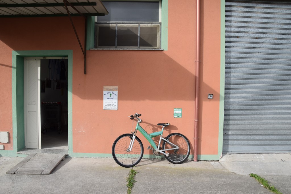 Samugheo - Mulino Sulis - the entrance to the mill and the owner's color-coordinated bicycle