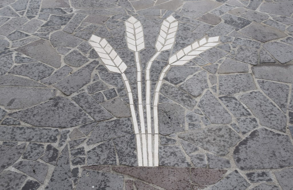 Samugheo - Shafts of wheat - the central theme of the stone mosaic entrance to Pane Nostu