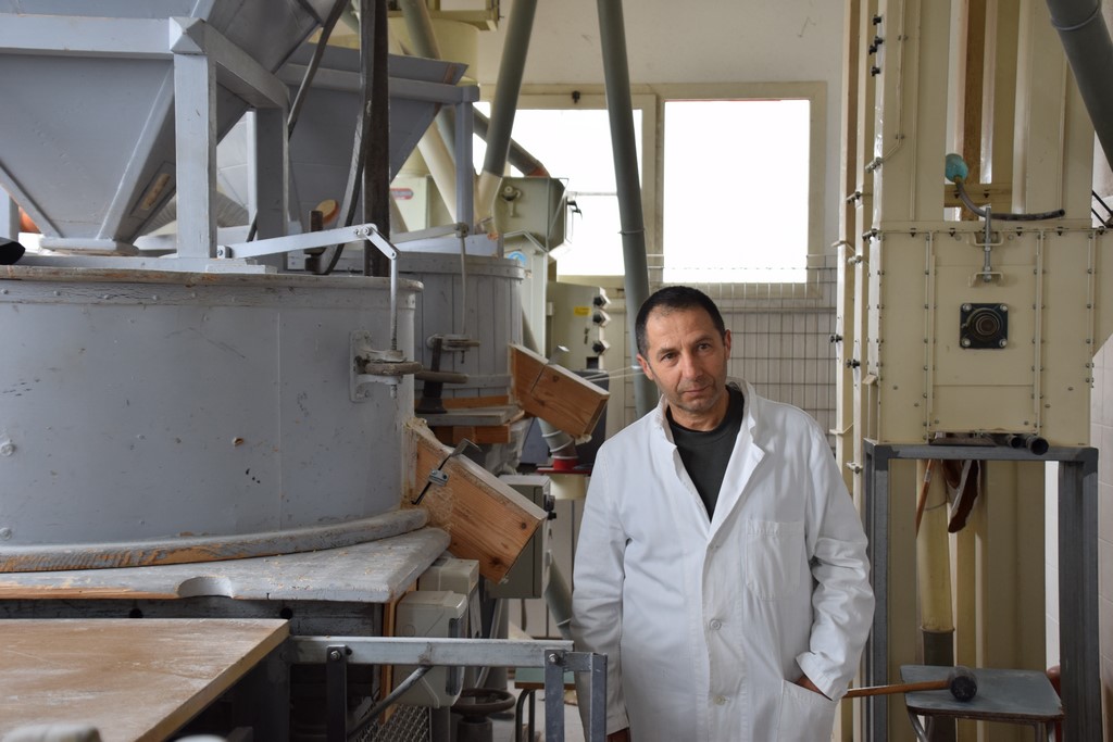 Samugheo - Mulino Sulis - Bruno Sulis showing us his mechanized millstone machines and discussing the process of milling grain