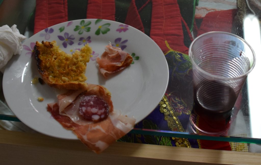 Samugheo - Pane Nostu - The remains of my lunch - salami, sweet prosciutto, freshly baked bread toasted and drizzled with olive oil, and locally produced wine - YUM