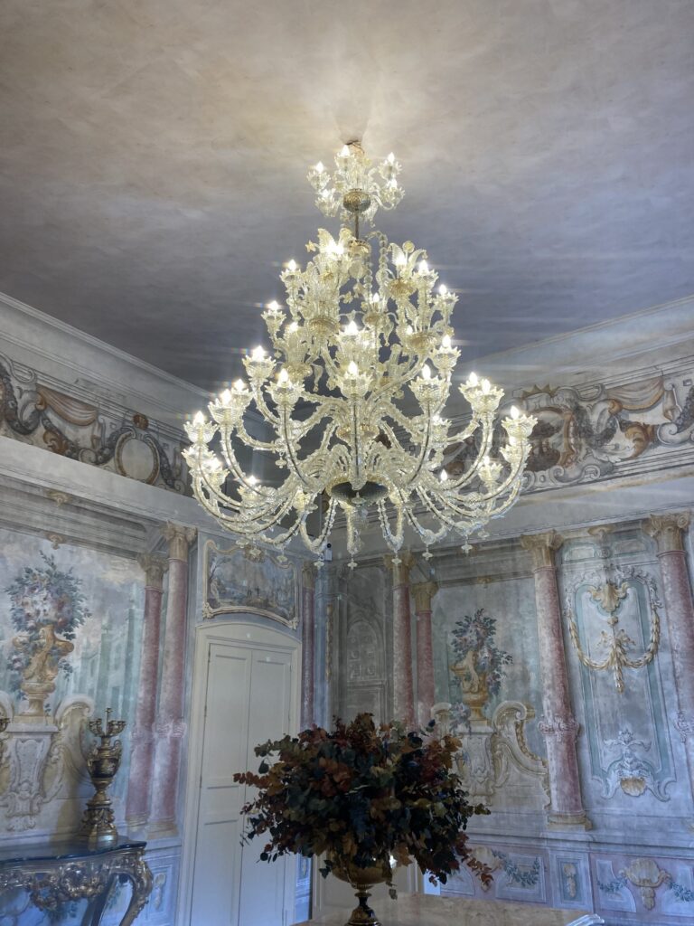 A Napolitan chandelier and some of the restored fresco walls