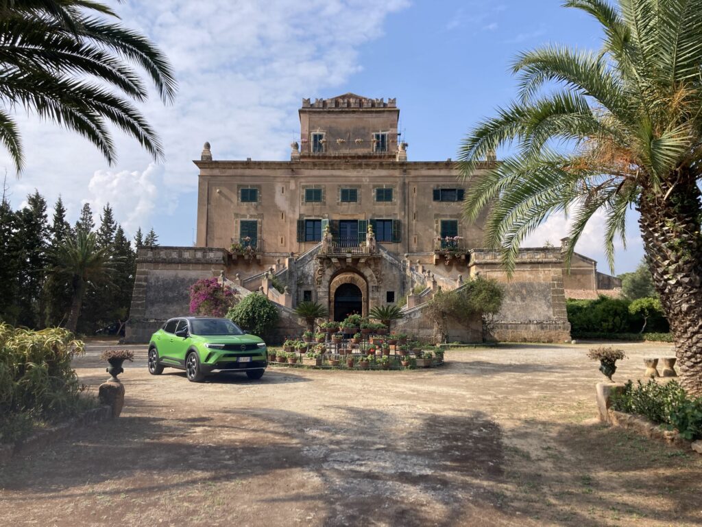 Our electric Vauxhall Mokka parked outside Castello San Marco